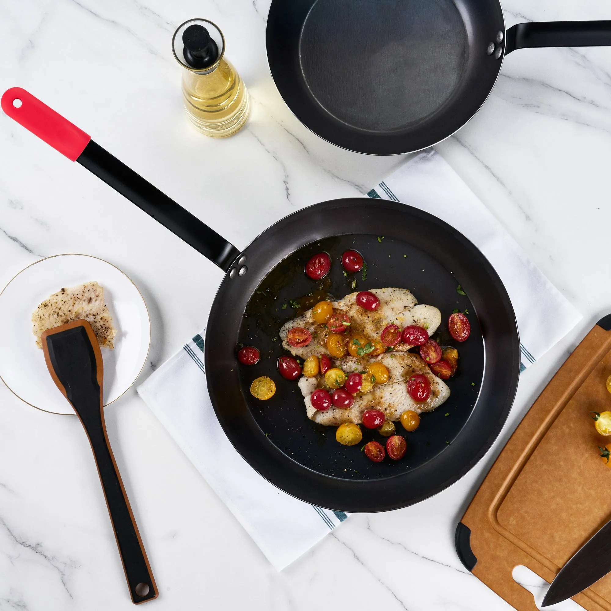 Met Lux 1 Black Carbon Steel 14" Pre-Seasoned Fry Pan and 1 Red Silicone Pan Handle Sleeve