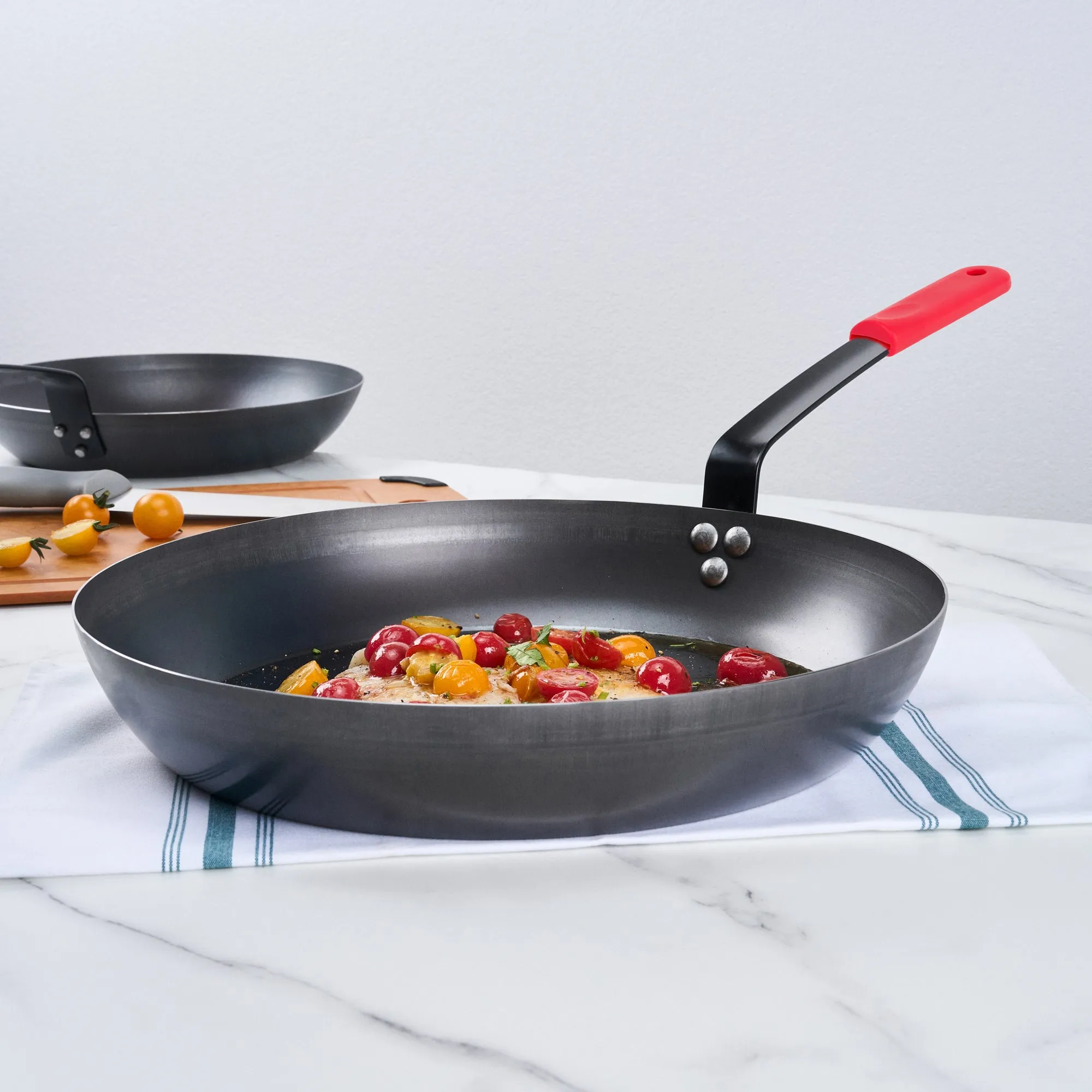 Met Lux 1 Black Carbon Steel 14" Pre-Seasoned Fry Pan and 1 Red Silicone Pan Handle Sleeve